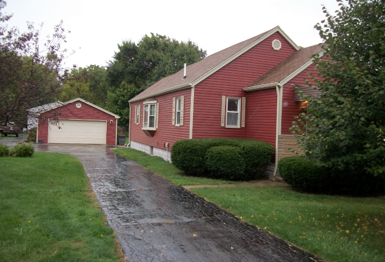 After- Custom red siding and tan trim